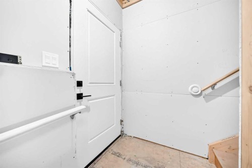 24 Emerson Crescent, Okotoks, AB - Indoor Photo Showing Garage