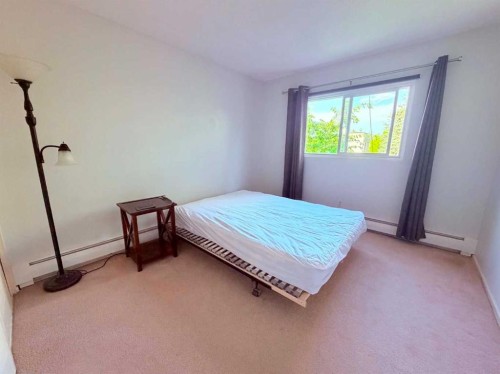 129-6919 Elbow Drive Sw, Calgary, AB - Indoor Photo Showing Bedroom