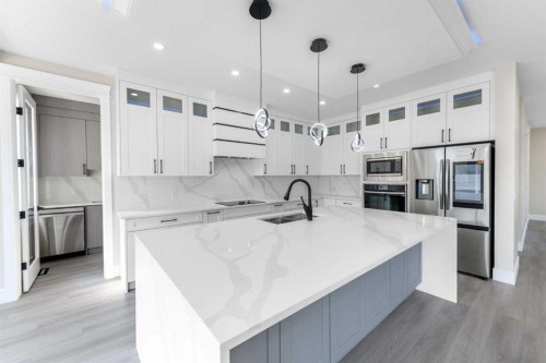 1004 Waterford Drive, Chestermere, AB - Indoor Photo Showing Kitchen With Double Sink With Upgraded Kitchen