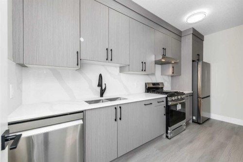 1004 Waterford Drive, Chestermere, AB - Indoor Photo Showing Kitchen With Double Sink