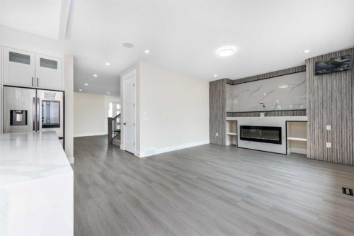 1004 Waterford Drive, Chestermere, AB - Indoor Photo Showing Living Room With Fireplace