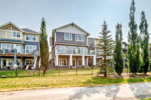 79 Sundown Way, Cochrane, AB - Outdoor With Facade