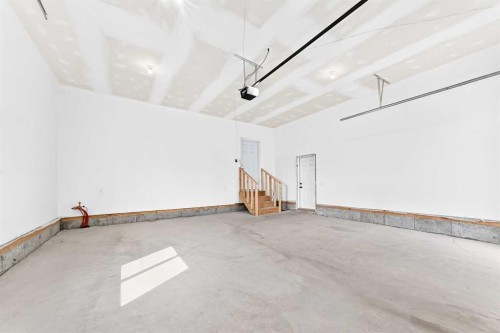 79 Sundown Way, Cochrane, AB - Indoor Photo Showing Garage