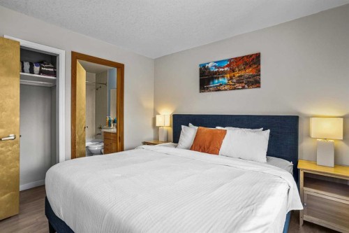 401-160 Kananaskis Way, Canmore, AB - Indoor Photo Showing Bedroom