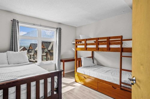 401-160 Kananaskis Way, Canmore, AB - Indoor Photo Showing Bedroom