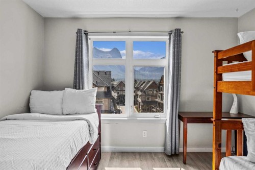 401-160 Kananaskis Way, Canmore, AB - Indoor Photo Showing Bedroom