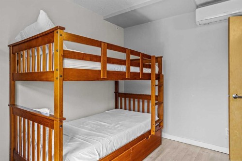 401-160 Kananaskis Way, Canmore, AB - Indoor Photo Showing Bedroom