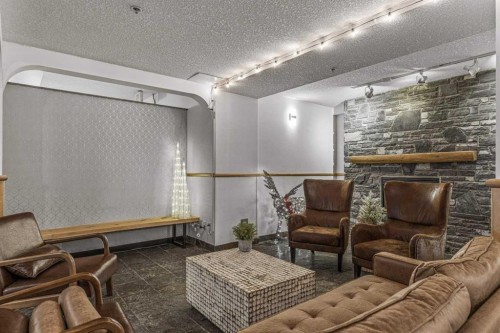 401-160 Kananaskis Way, Canmore, AB - Indoor With Fireplace