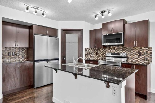 377 Panora Way Nw, Calgary, AB - Indoor Photo Showing Kitchen With Stainless Steel Kitchen With Double Sink With Upgraded Kitchen