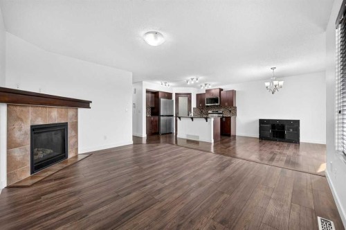 377 Panora Way Nw, Calgary, AB - Indoor Photo Showing Living Room With Fireplace