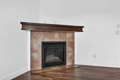 377 Panora Way Nw, Calgary, AB - Indoor Photo Showing Living Room With Fireplace