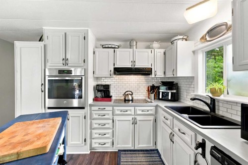 32545 Range Road 25, Rural Mountain View County, AB - Indoor Photo Showing Kitchen With Double Sink