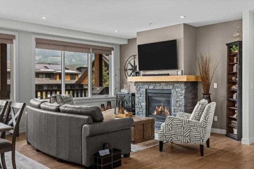 311-1315 Spring Creek Gate, Canmore, AB - Indoor Photo Showing Living Room With Fireplace