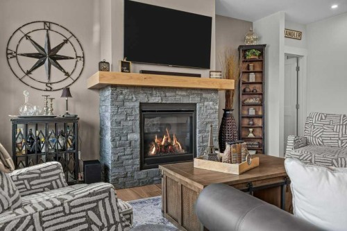 311-1315 Spring Creek Gate, Canmore, AB - Indoor Photo Showing Living Room With Fireplace