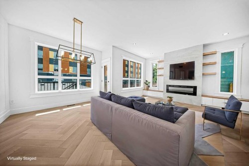 119 42 Avenue Ne, Calgary, AB - Indoor Photo Showing Living Room With Fireplace