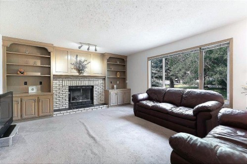 140 Santana Mews Nw, Calgary, AB - Indoor Photo Showing Living Room With Fireplace