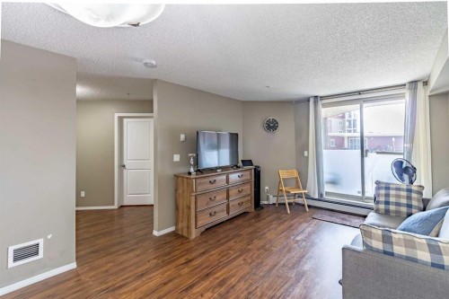 1108-5 Saddlestone Way Ne, Calgary, AB - Indoor Photo Showing Living Room