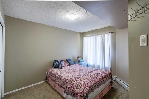 1108-5 Saddlestone Way Ne, Calgary, AB - Indoor Photo Showing Bedroom
