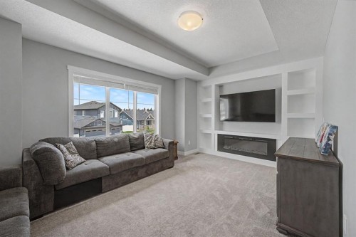 1340 Lackner Boulevard, Carstairs, AB - Indoor Photo Showing Living Room With Fireplace
