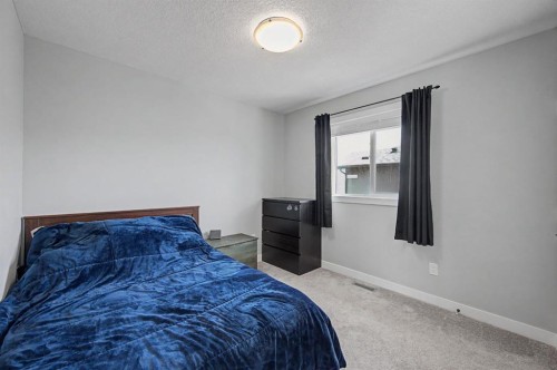 1340 Lackner Boulevard, Carstairs, AB - Indoor Photo Showing Bedroom