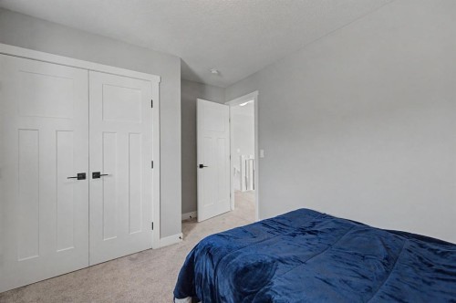 1340 Lackner Boulevard, Carstairs, AB - Indoor Photo Showing Bedroom