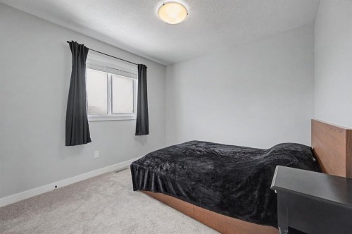 1340 Lackner Boulevard, Carstairs, AB - Indoor Photo Showing Bedroom