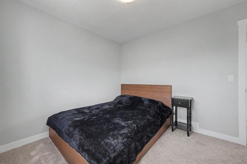 1340 Lackner Boulevard, Carstairs, AB - Indoor Photo Showing Bedroom
