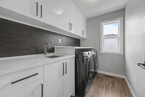 1340 Lackner Boulevard, Carstairs, AB - Indoor Photo Showing Laundry Room