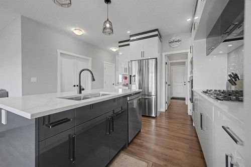 1340 Lackner Boulevard, Carstairs, AB - Indoor Photo Showing Kitchen With Double Sink With Upgraded Kitchen