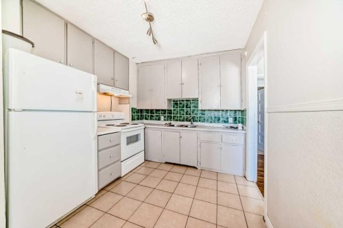 1610 40 Street Sw, Calgary, AB - Indoor Photo Showing Kitchen With Double Sink