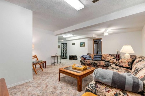 15 Sunrise Crescent Se, Calgary, AB - Indoor Photo Showing Living Room