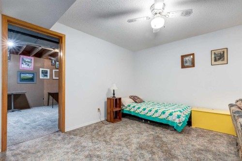 15 Sunrise Crescent Se, Calgary, AB - Indoor Photo Showing Bedroom