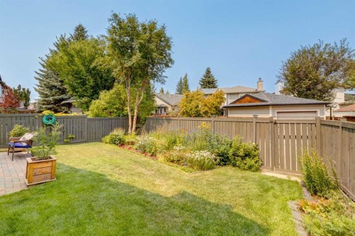 15 Sunrise Crescent Se, Calgary, AB - Outdoor With Backyard