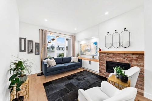 1703 31 Avenue Sw, Calgary, AB - Indoor Photo Showing Living Room With Fireplace