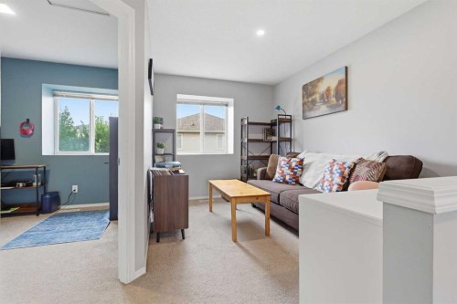 402-703 Luxstone Square Sw, Airdrie, AB - Indoor Photo Showing Living Room