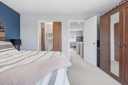 402-703 Luxstone Square Sw, Airdrie, AB - Indoor Photo Showing Bedroom