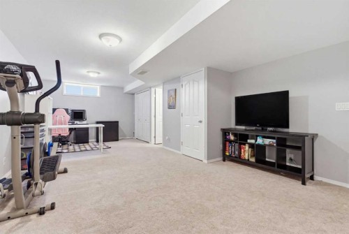 402-703 Luxstone Square Sw, Airdrie, AB - Indoor Photo Showing Gym Room