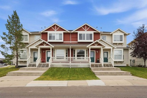 402-703 Luxstone Square Sw, Airdrie, AB - Outdoor With Deck Patio Veranda With Facade