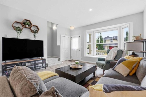 402-703 Luxstone Square Sw, Airdrie, AB - Indoor Photo Showing Living Room