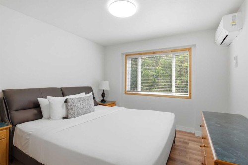 114-1720 Bow Valley Trail, Canmore, AB - Indoor Photo Showing Bedroom
