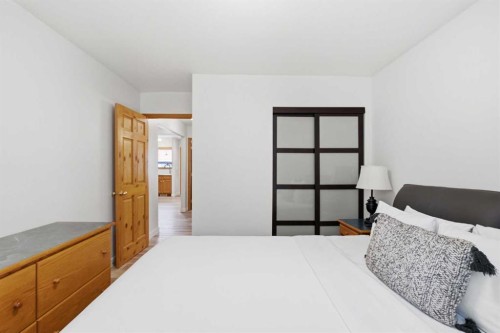 114-1720 Bow Valley Trail, Canmore, AB - Indoor Photo Showing Bedroom