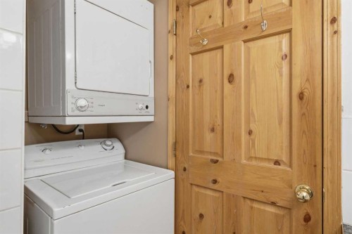114-1720 Bow Valley Trail, Canmore, AB - Indoor Photo Showing Laundry Room