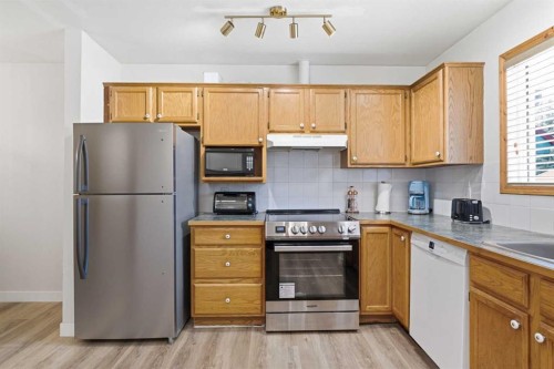114-1720 Bow Valley Trail, Canmore, AB - Indoor Photo Showing Kitchen