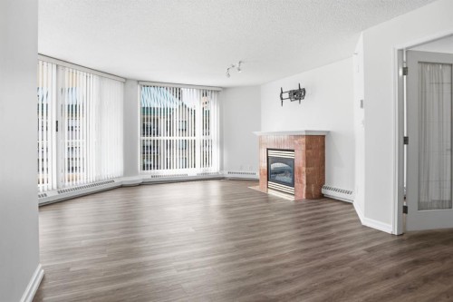 804-804 3 Avenue Sw, Calgary, AB - Indoor Photo Showing Living Room With Fireplace