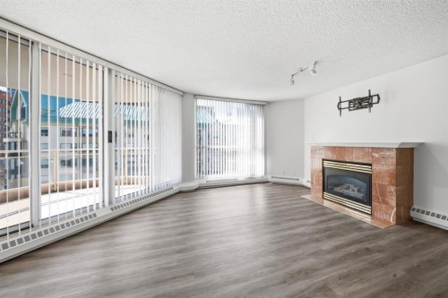 804-804 3 Avenue Sw, Calgary, AB - Indoor Photo Showing Other Room With Fireplace