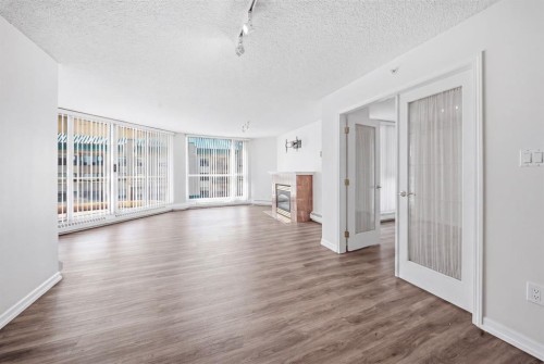 804-804 3 Avenue Sw, Calgary, AB - Indoor Photo Showing Living Room With Fireplace