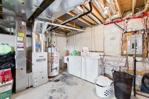 936 Windsong Drive Sw, Airdrie, AB - Indoor Photo Showing Laundry Room