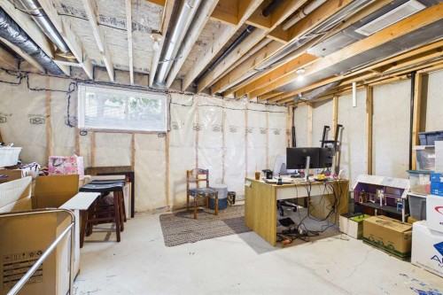 936 Windsong Drive Sw, Airdrie, AB - Indoor Photo Showing Basement