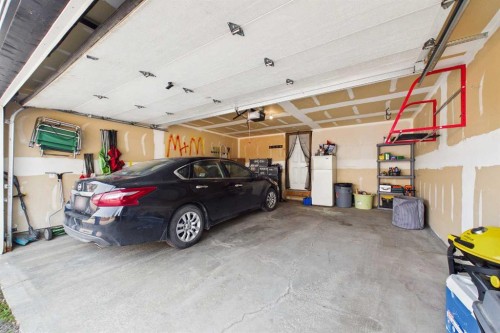936 Windsong Drive Sw, Airdrie, AB - Indoor Photo Showing Garage