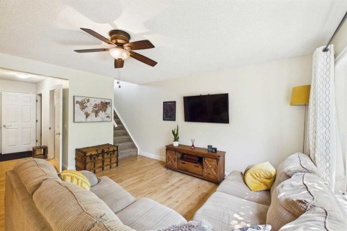 936 Windsong Drive Sw, Airdrie, AB - Indoor Photo Showing Living Room